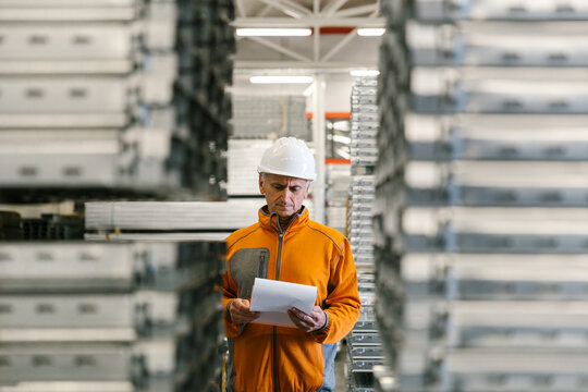 Man Checking Production Statistics Of Aluminium Profiles