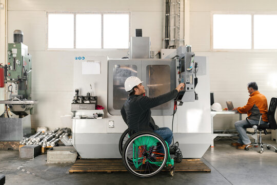 Disabled Worker Working With A Machine