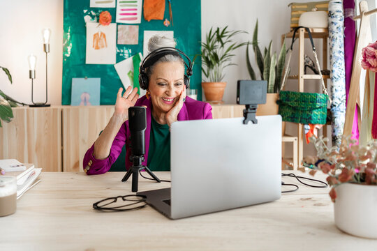 Sebior fashion designer woman doing video chat