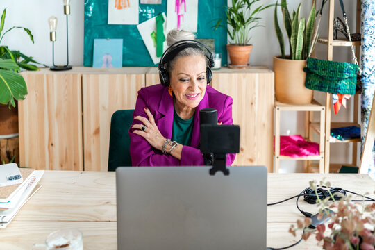 Famous designer woman doing video chat