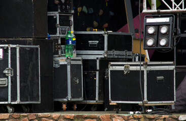 live music stage, with audio and lighting equipment in container boxes