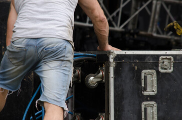 music industry worker, lead setting up live music stage