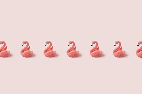 Row of pink easter flamingo on pastel background