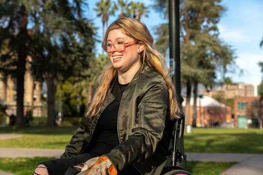Woman in Wheelchair Smiles in the Sun