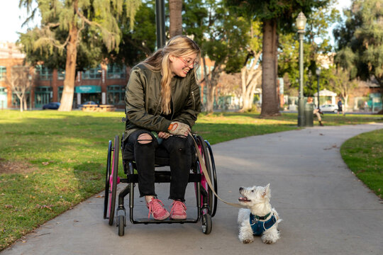 Disabled Woman and Dog Enjoy a Public Park