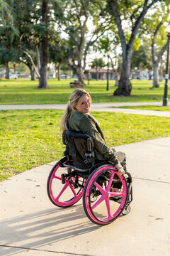 Woman in Wheelchair Enjoys a Public Park