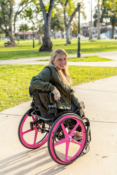 Woman in a Wheelchair Enjoys a Public Park