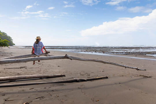 Portrait of of woman in hat at beach in Central America