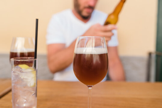 Man checking a beer bottle