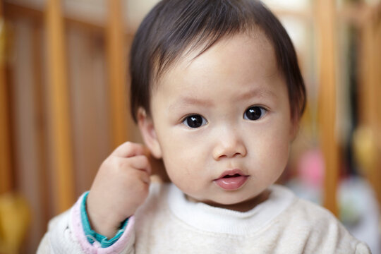 Closeup portrait of little cute asian baby

