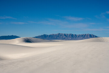 San Andres Mountains Peek Out From Behind Sweeping White Sand Dunes