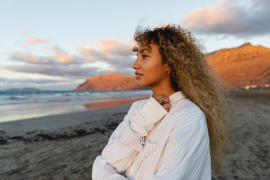 Portrait of woman looking at the ocean