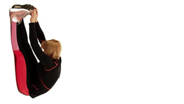 fit Adult person sitting and stretching on the ground after a good run