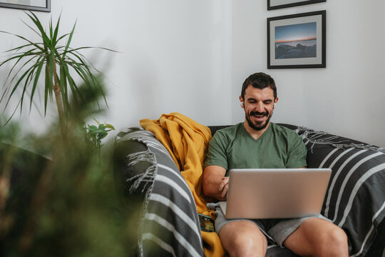 Smiling Man With Laptop