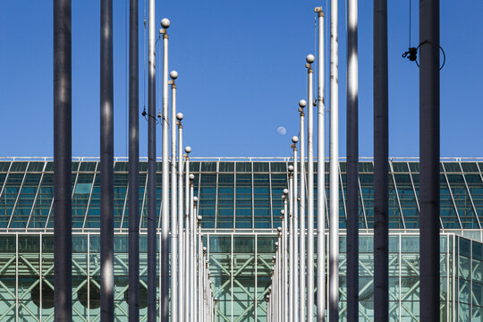 a line of flag poles with a vanishing point 