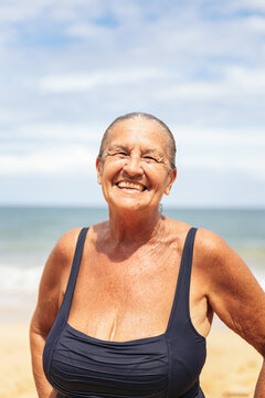 Portrait of a smiling senior woman on the beach