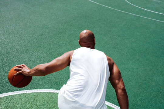Unrecognisable black man holding a basketball