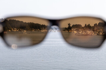 view of harbor town through pair of sunglasses