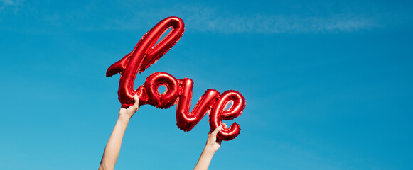 has the word love in his hands, web banner