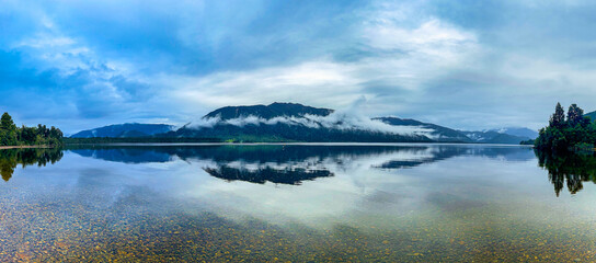 Lake Kaniere panorama on  a cloudy rainy misty day on New Zealand's West Coast