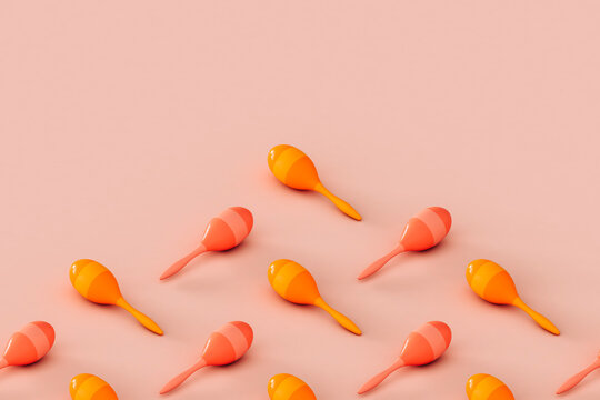 colorful maracas on a pink background