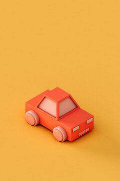 Pink toy car on a yellow background with copy space
