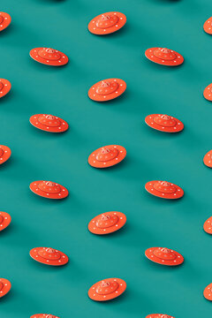 pattern of Pink UFOs or UAPs on a blue background. 