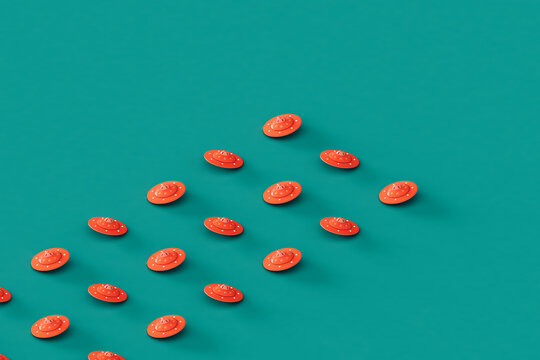 rows of Pink UFOs or UAPs on a blue background. 