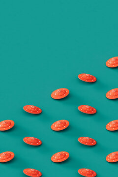 Pink UFOs on a blue background.  with copy space.
