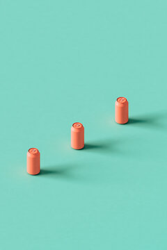 three Pink cans on a blue background crossing the frame