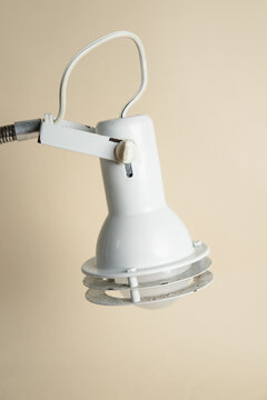 Close up of white vintage plastic and metal lamp shade 