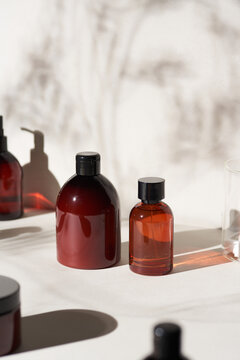 Brown bottles with beauty products in bathroom