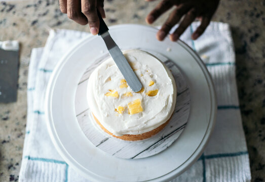 assembling a delicious cake with meringue