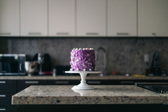 birthday meringue cake in a modern kitchen
