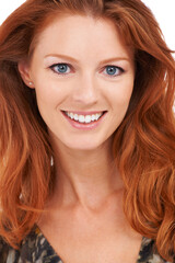 Flaming beauty. Closeup of a gorgeous smiling redhead with a perfect complexion, isolated on white - copyspace.