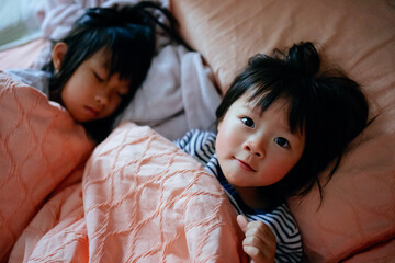  little child lying in bed