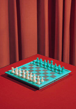 Still Life Chess Board On Red Background.