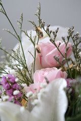 a pair of gold rings hanging on a flower branch