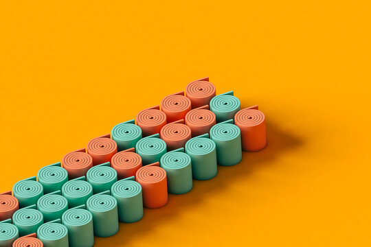 rows of colorful rolls on an orange background. 
