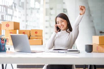 Entrepreneurs Small Business SME, Young Asian women happy after a new order from the customer,...