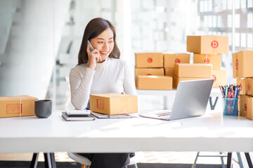 Entrepreneurs Small Business SME, Young Asian women happy after a new order from the customer,...