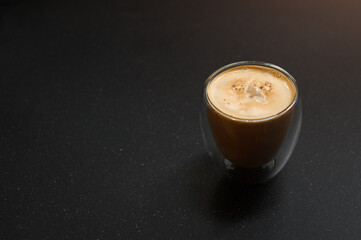 cup of coffee on black table in cafe