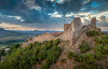 Fototapeta na wymiar Aerial view of newly restored Szigliget castle near lake Balaton in Veszprem county Hungary, with dramatic stormy sky