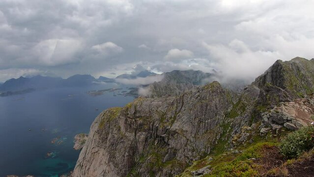 Timelapse over Henningsvaer from top of festvagtinden hiking path at the Lofoten Island in Norway. 4K UHD video.