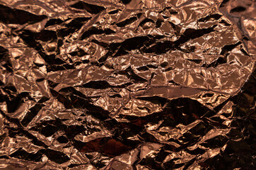 Abstract texture pattern metallic paper using as a background or wallpaper. Metal aluminum foil shiny and reflector