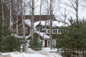 Modern house in the snowy forest