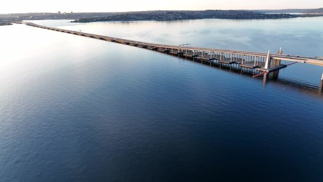 Cinematic 4K aerial drone pan shot of the 520 freeway Evergreen Pt floating bridge on Lake Washington with views of Laurelhurst, University District, Madison Park