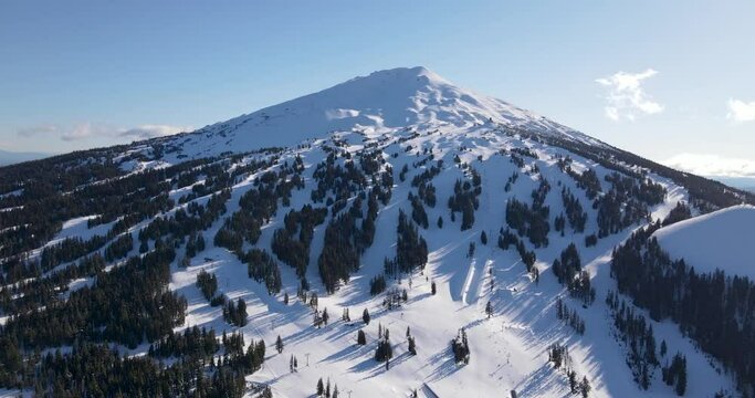 Pulling out aerial shot of Mount Bachelor