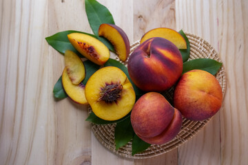 Yellow Peach with slice on wooden background. Fresh Yellow Peach.