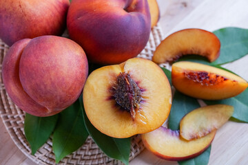 Yellow Peach with slice on wooden background. Fresh Yellow Peach.